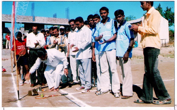 Prin.Hitendra Aher Is seen in the picture While Inaugurating Inter Collegiate Ball Badminton Competitions 2013-14