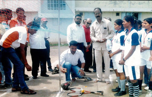 X-Student P.S.I Kunal Suryawanshi is seen the picture while Inlaugrating Inter Collegiate Ball Badminton Women Competiotions 2013-14